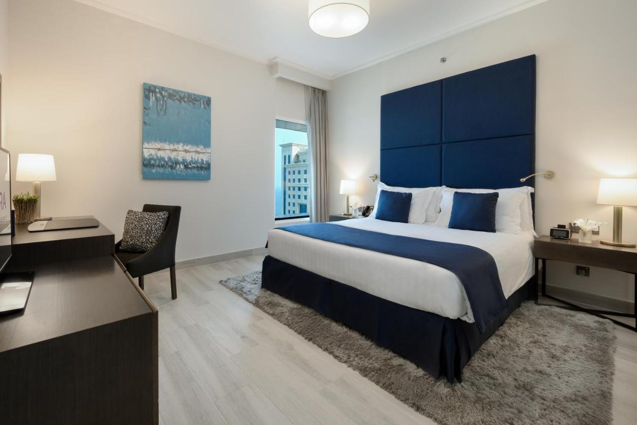 Centara West Bay Hotel & Residences Доха Екстериор снимка A bedroom at the hotel