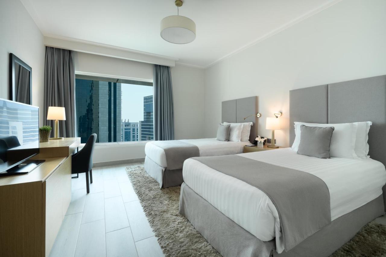 Centara West Bay Hotel & Residences Доха Екстериор снимка A guest room at the hotel