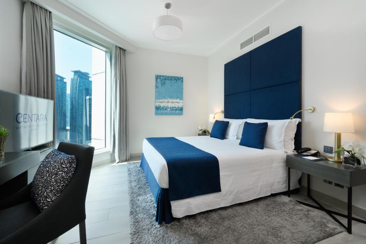 Centara West Bay Hotel & Residences Доха Екстериор снимка A bedroom at the Address Downtown Hotel